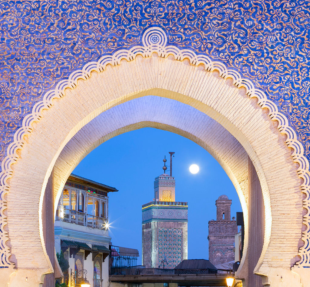 Bab Bou Jeloud gate (The Blue Gate) located at Fez, Morocco at sunset.